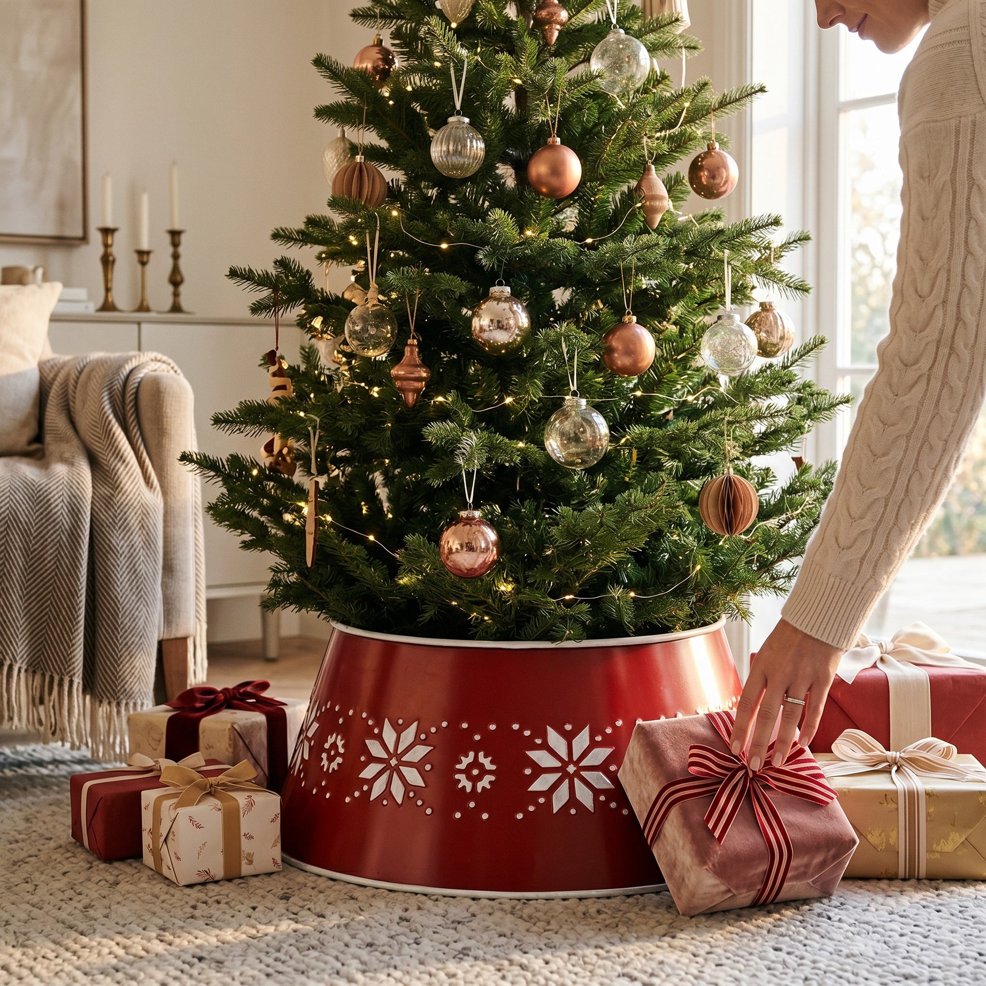 Family Bazaar red metal Christmas tree stand cover with white snowflake pattern, 70 cm diameter.